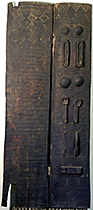 Bambara lock with key on wood stand 